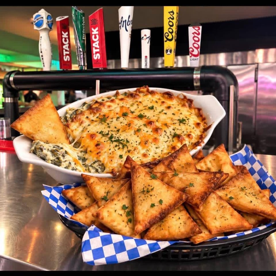 Baked dip and toasted pita at the bar